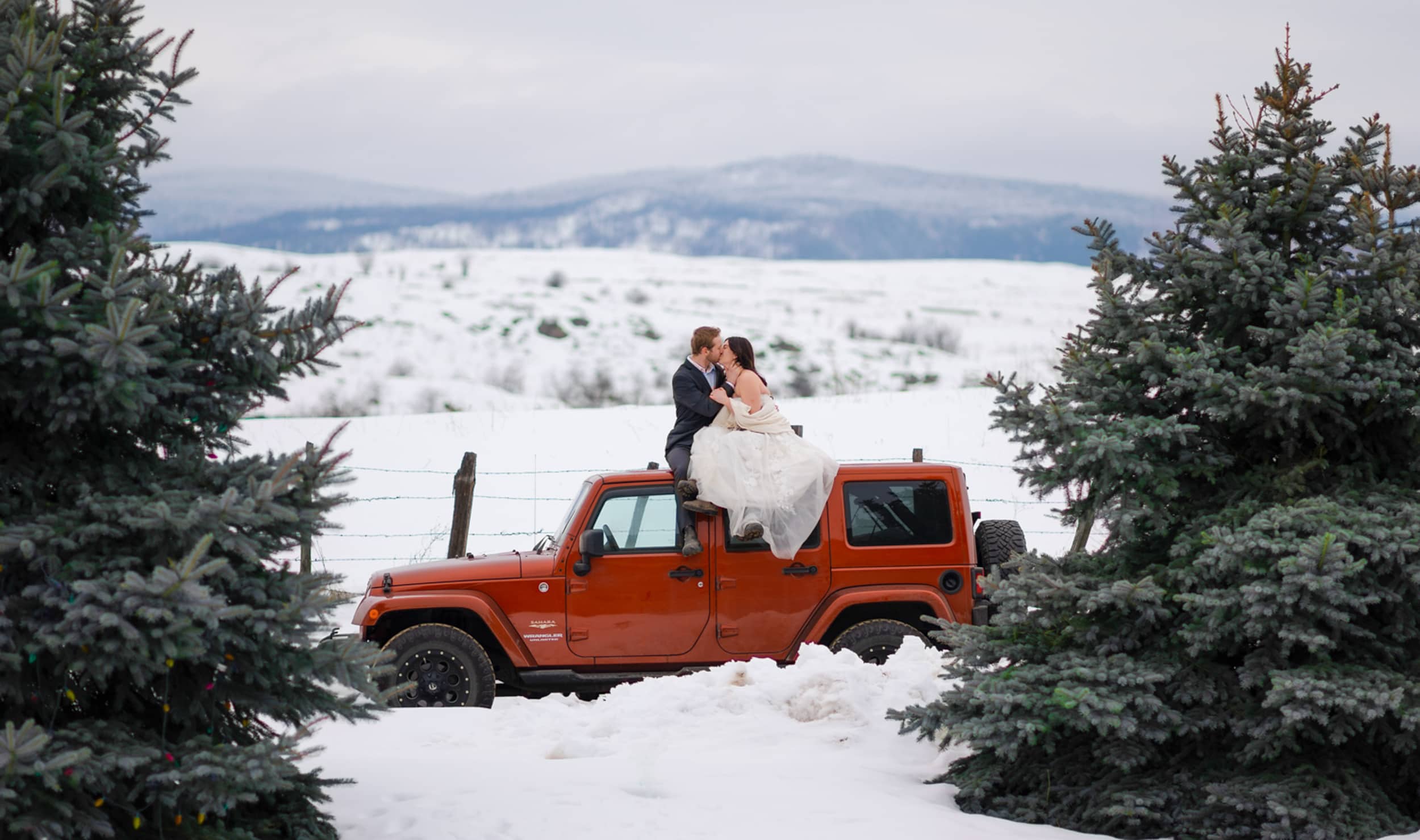 Vancouver Elopement and Destination wedding photographer - bride and groom on red Jeep